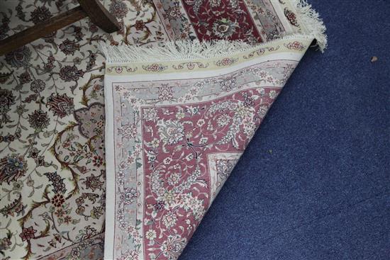 A modern Turkish Tabriz style part silk carpet, 9ft 10in by 6ft 8in.